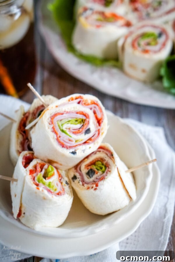 A white bowl with several Italian Pinwheels stacked inside.