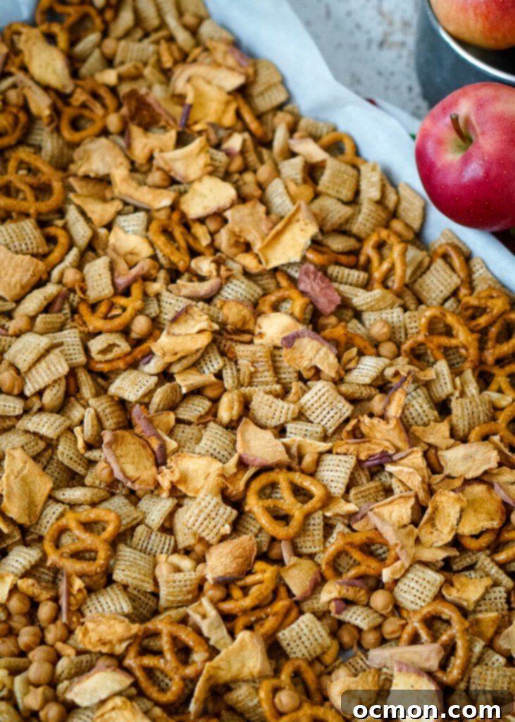 Caramel Apple Crunch Mix 9 The apple chips and the caramel chips are added into the completely cooled cereal mixture, completing the Caramel Apple Chex Mix.