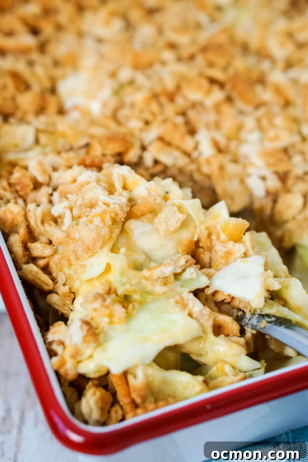 Effortless Creamy Cabbage Bake 8 Easy Scalloped Cabbage Casserole with a crispy topping in a white dish.