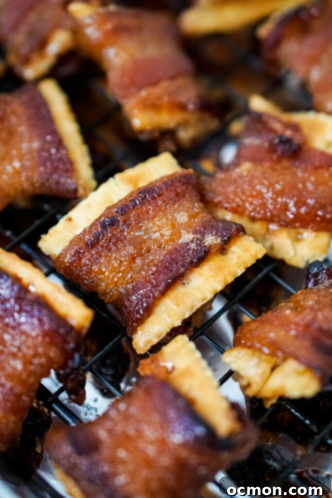 Cajun Caramelized Bacon Cracker Crunch 7 A fresh batch of Cajun Candied Bacon Crackers cooling on a baking tray, showing their delicious caramelized finish.