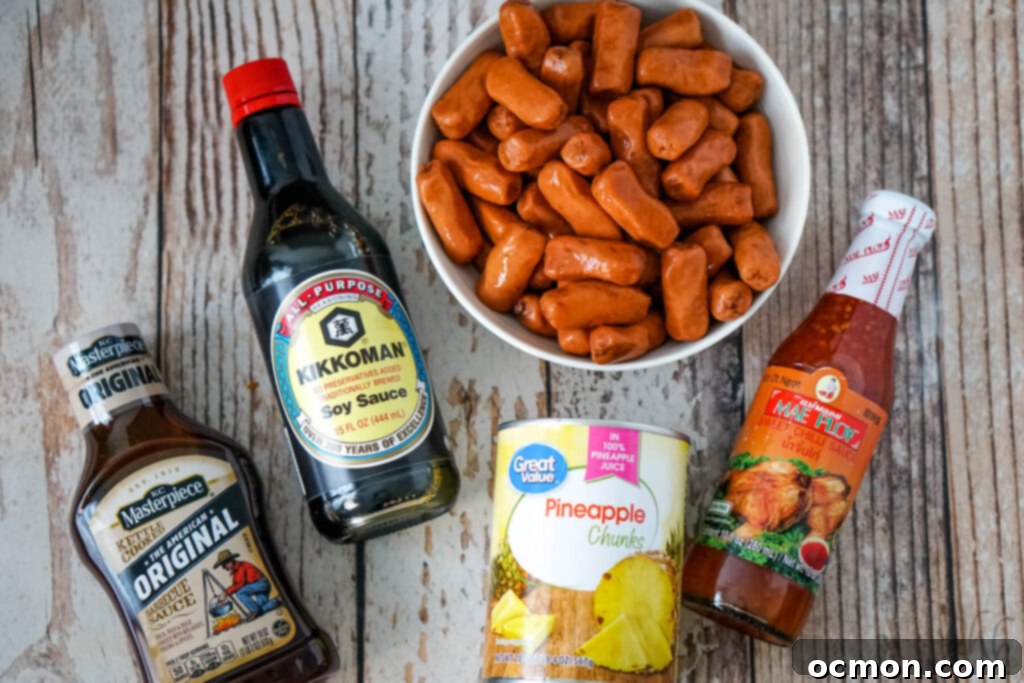 Aloha Smokies 5 A visual lineup of ingredients: Original barbecue sauce, Kikkoman Soy Sauce, a bowl of Lit'l Smokies, a can of pineapple chunks, and Mae Ploy sweet chili sauce, ready for mixing.