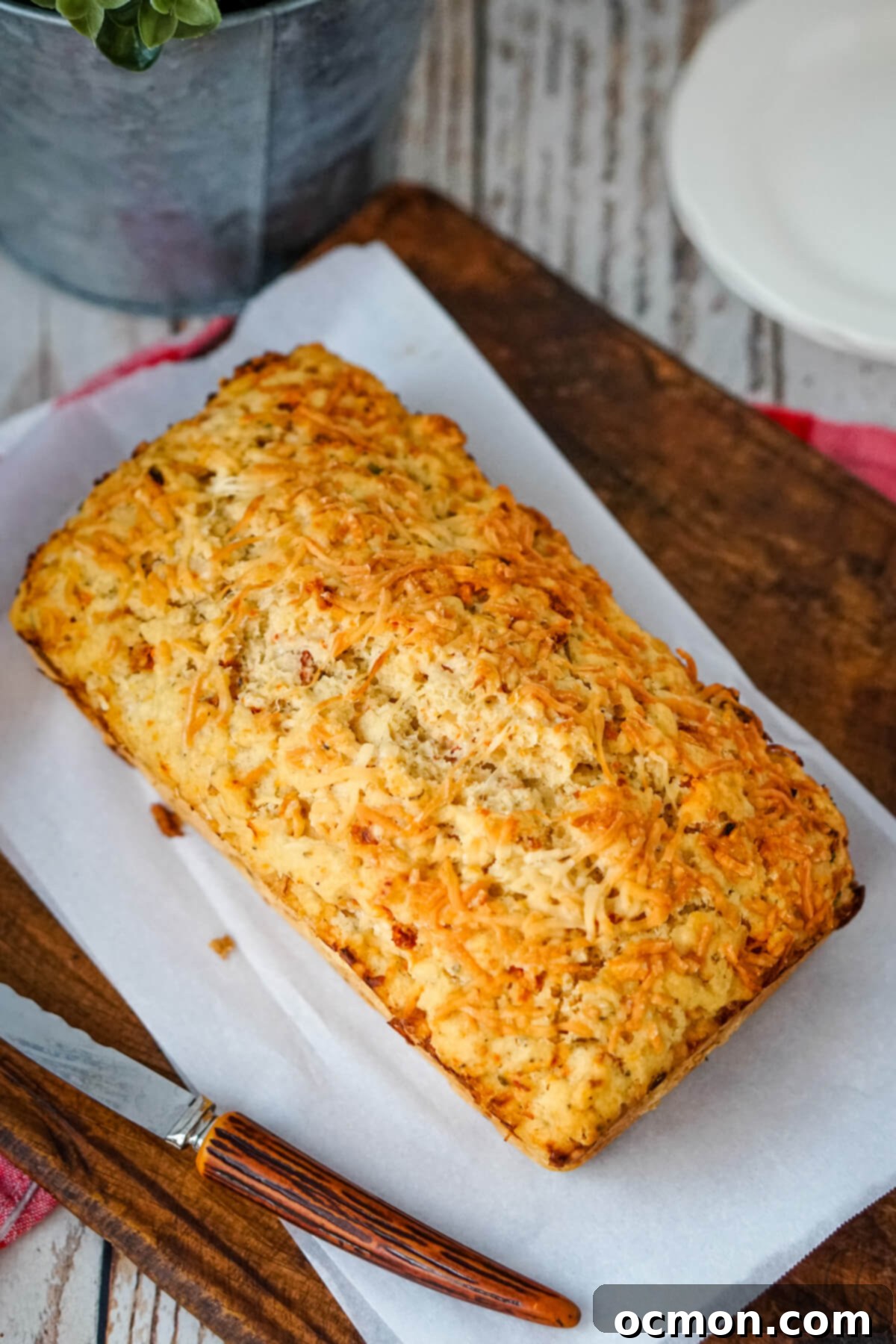 Delicious Sun-dried Tomato and Parmesan Beer Bread, freshly baked and ready to be enjoyed.
