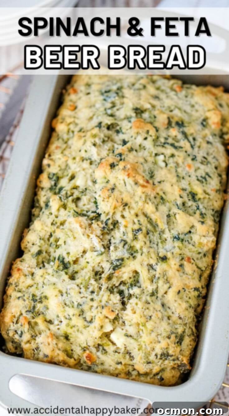 A vibrant image of the Spinach and Feta Beer Bread, perfect for pinning, with text overlay: 'Spinach and Feta Beer Bread is an easy to make no fuss bread recipe. This fun twist on beer bread combines the tanginess of feta with the earthiness of spinach for a moist and flavorful beer bread that makes a perfect side to soups and stews, but is also great to eat all by itself.'