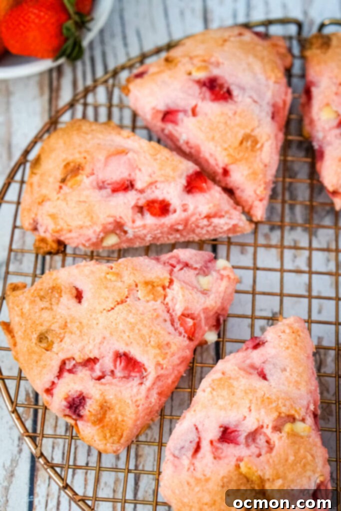 Strawberry Cake Scone Magic 9 Strawberry cake mix scones cooling on a wire rack.