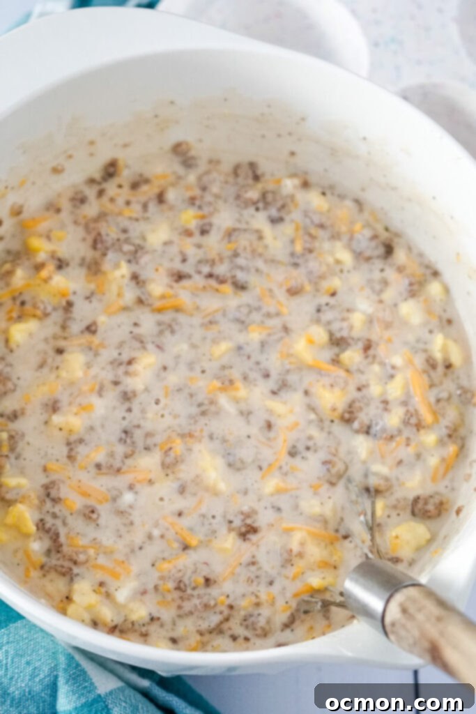 The McGriddle muffin mixture is stirred together thoroughly with a whisk in a large bowl.