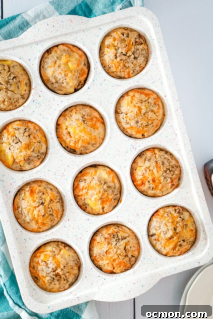 The golden brown McGriddle muffins have been taken out of the oven and are cooling in the tin, showing their perfect domed tops.