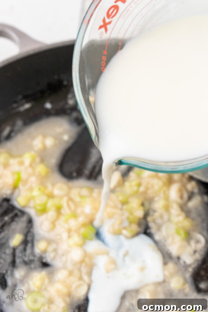 Milk is poured into the skillet.