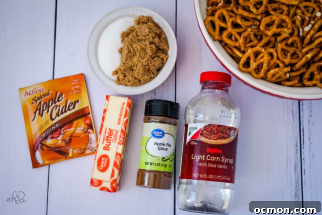 Spiced Apple Cider Pretzels 6 All the essential ingredients for apple cider pretzels laid out: apple cider drink mix packets, melted butter, rich brown and white sugars, corn syrup, fragrant apple pie spice, and a bag of mini twist pretzels.