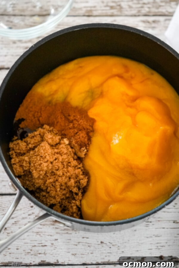 Spiced Pumpkin Delight 4 Pumpkin butter ingredients simmering in a saucepan.