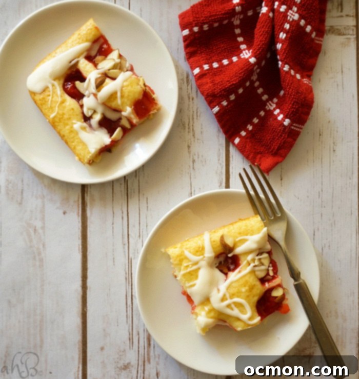 Cherry Almond Squares cooling on a wire rack, ready for the sweet almond glaze and a dusting of sliced almonds.