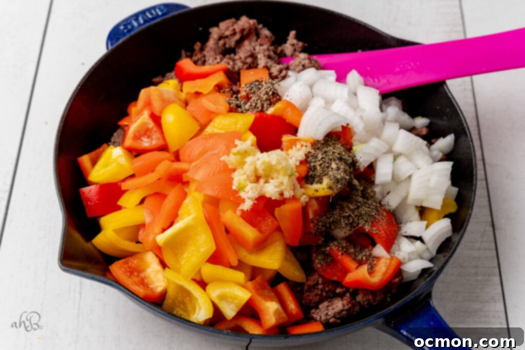 Skillet Pizza Peppers 4 The onion, pepper, minced garlic, basil, and ground pepper to the pan.