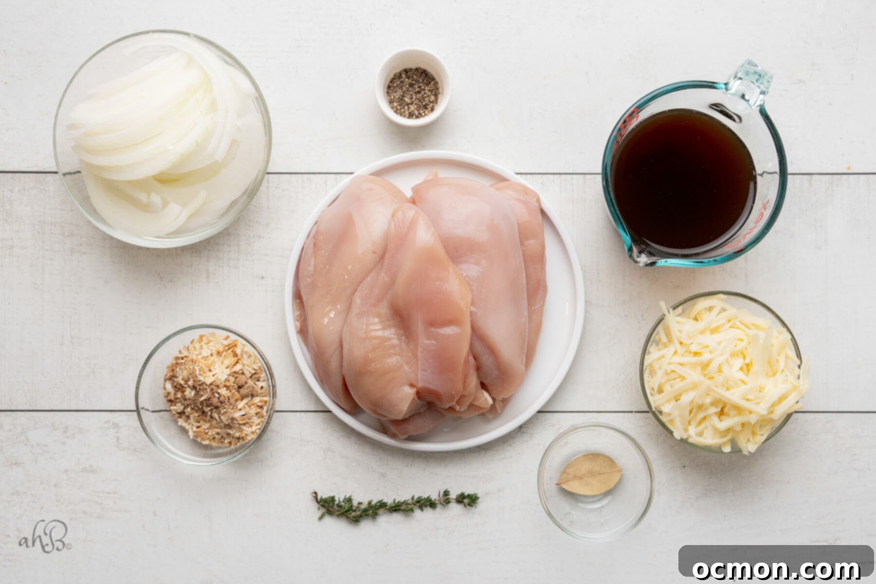 Easy Slow Cooker French Onion Chicken 4 The ingredients for French Onion chicken are separated into different glass bowls.