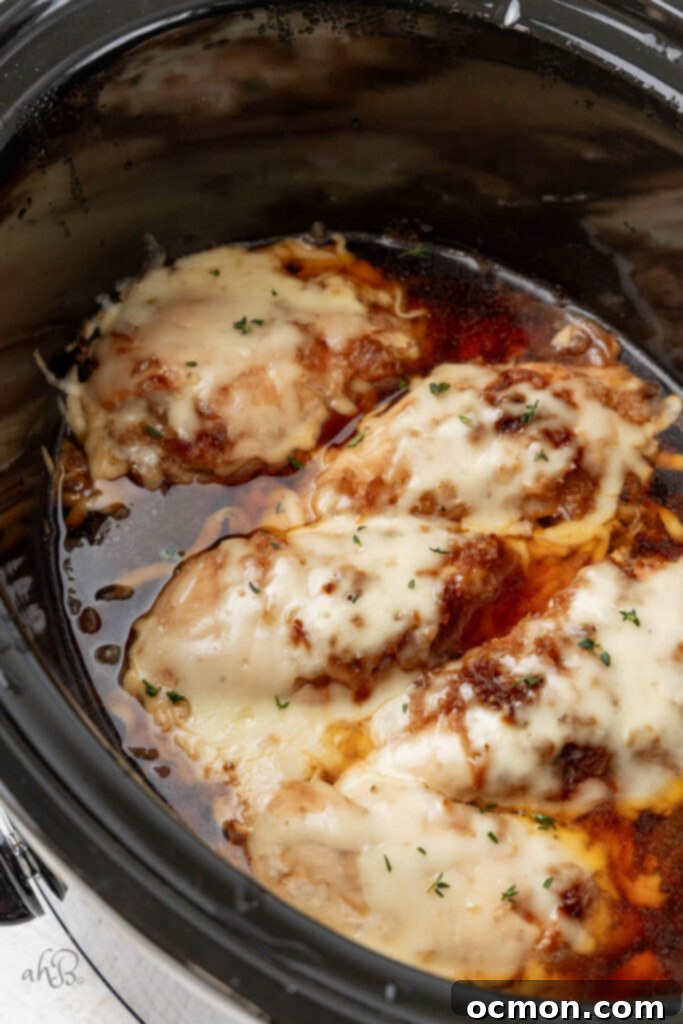 Easy Slow Cooker French Onion Chicken 9 The cheese is melted onto the chicken.