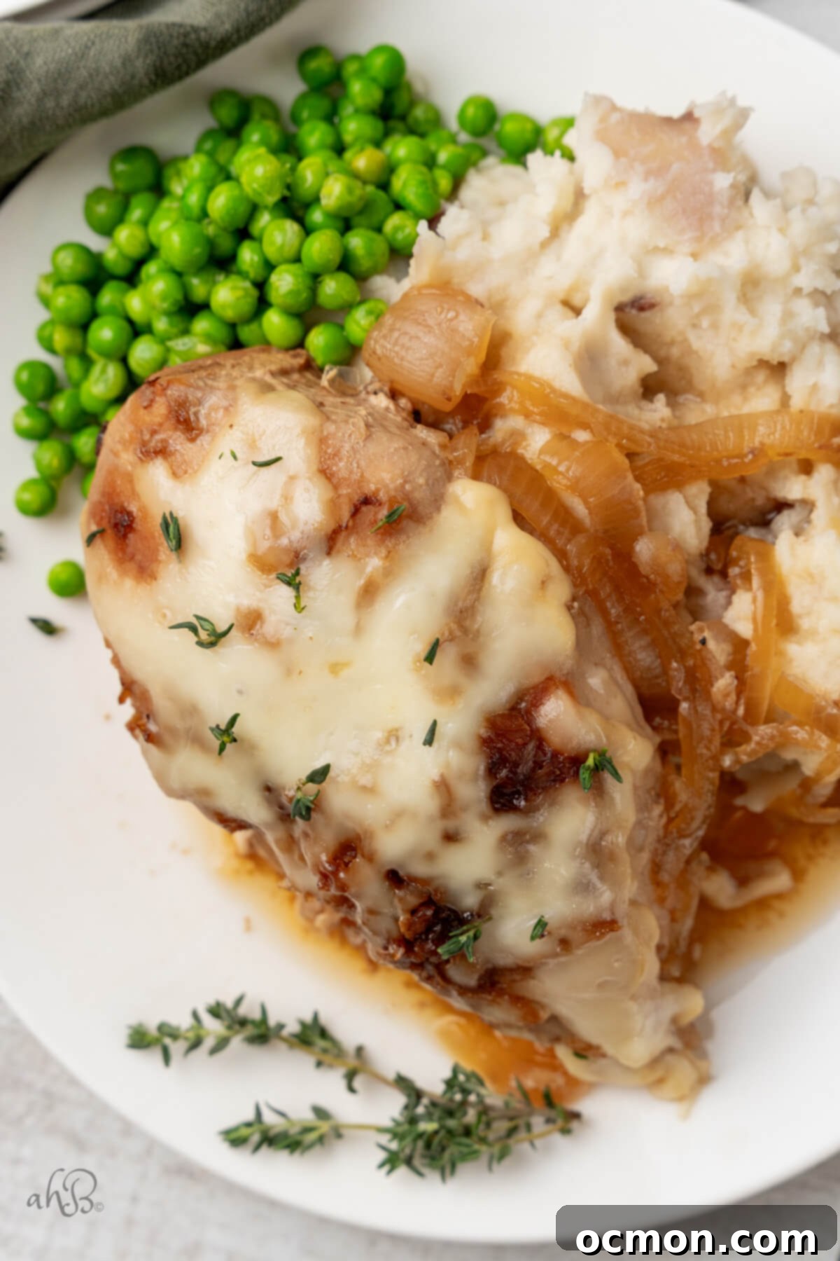 Easy Slow Cooker French Onion Chicken 10 French Onion Chicken served on a plate.