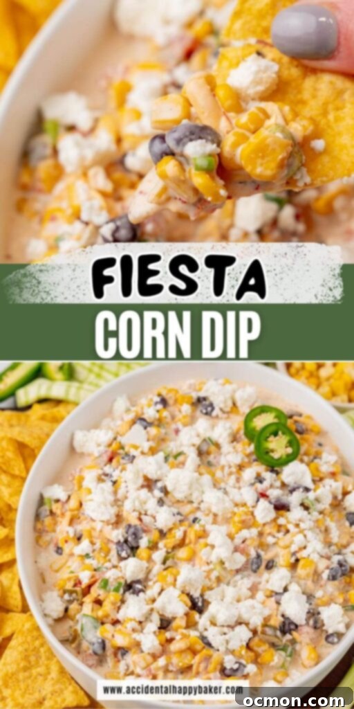 A beautifully presented serving bowl of Fiesta Corn Dip, garnished with fresh toppings, with a scattering of crispy tortilla chips on the side, highlighting its appeal as a perfect party dip.