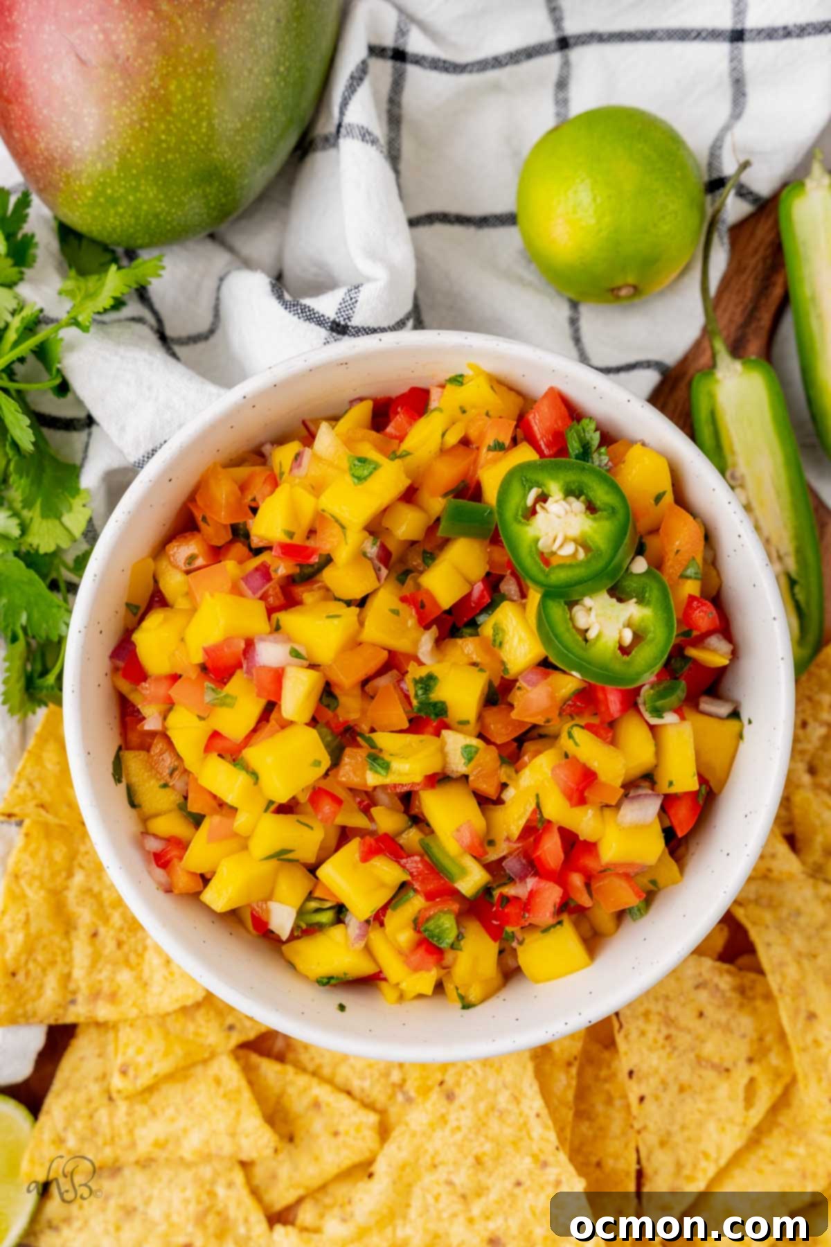 Sunshine Heat Mango Salsa 9 A bowl of fresh, vibrant spicy mango salsa, ready to be served.