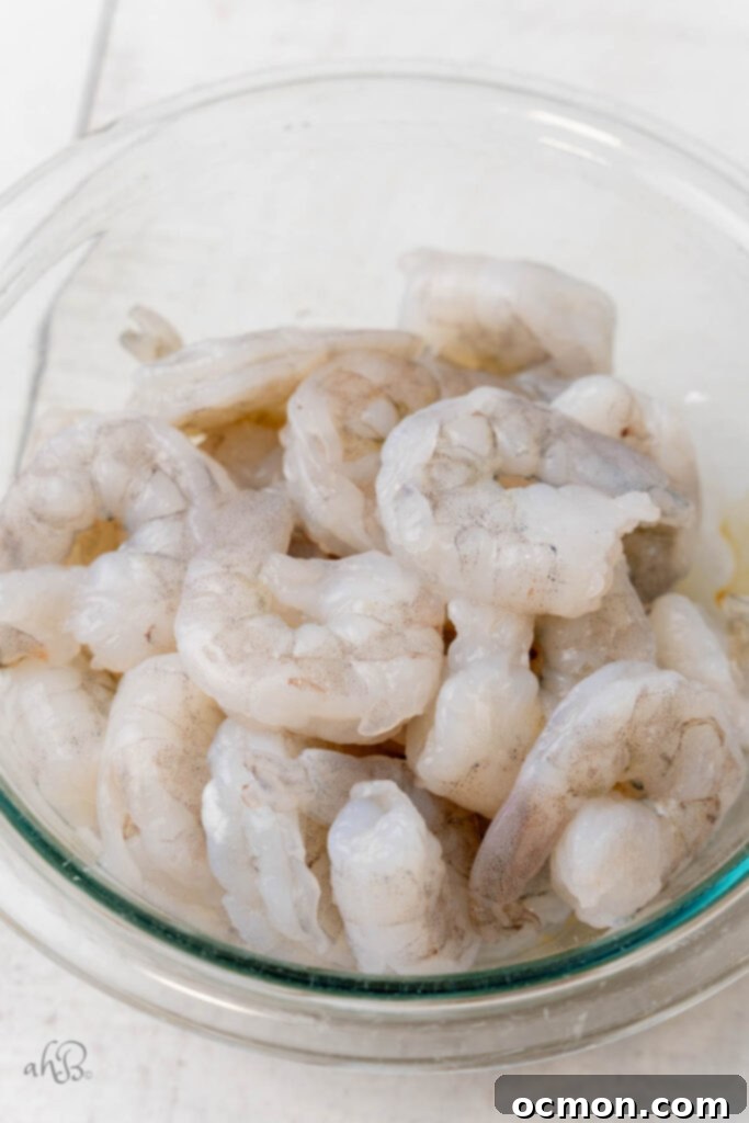 Step 1: Thaw the shrimp if using frozen and pat dry. Remove tails if desired. 
