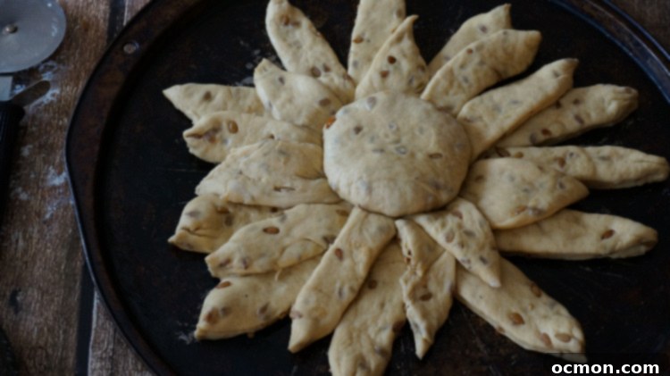 Beautifully shaped Sunflower Bread loaf, ready for baking, showcasing the intricate petal design.