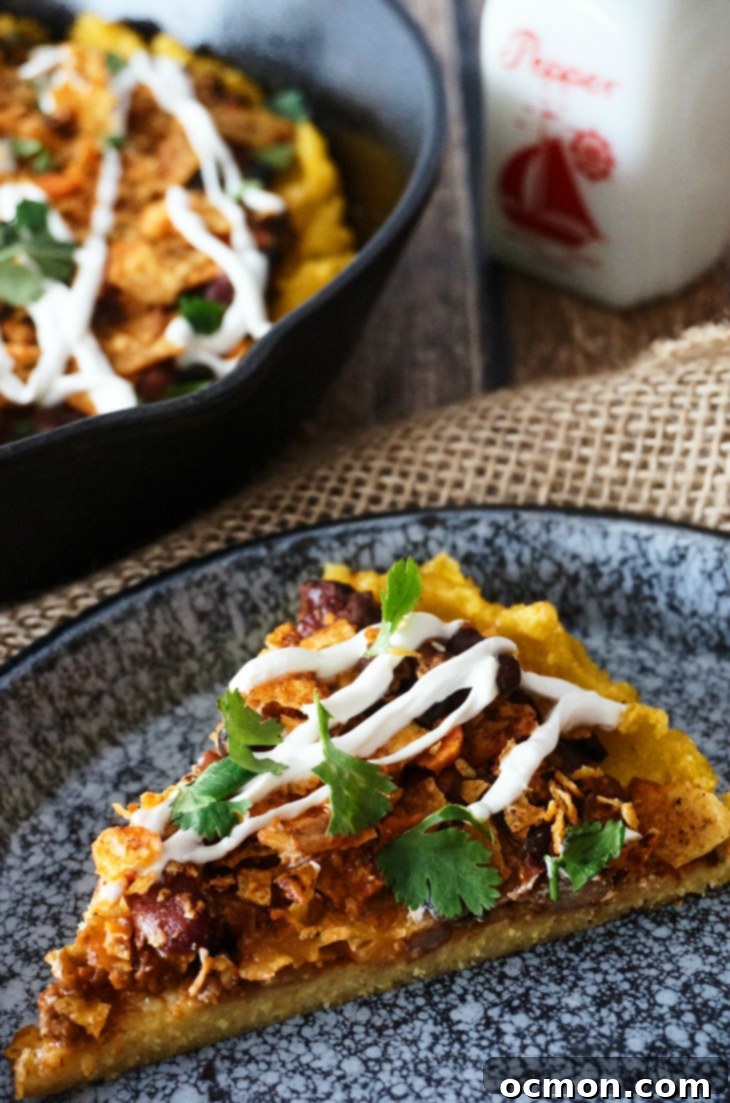 Crispy-edged, creamy-centered polenta topped with chili, cheese, and crunchy crushed nacho chips. No one will ever guess that this chili cheese polenta is a frugal leftover makeover, unless you tell them that is! 