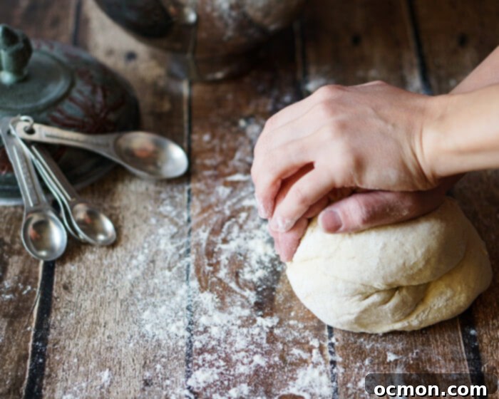 Sweet Onion Rolls 4 Caramelized Onion Buns cooling on a wire rack in a rustic kitchen setting.