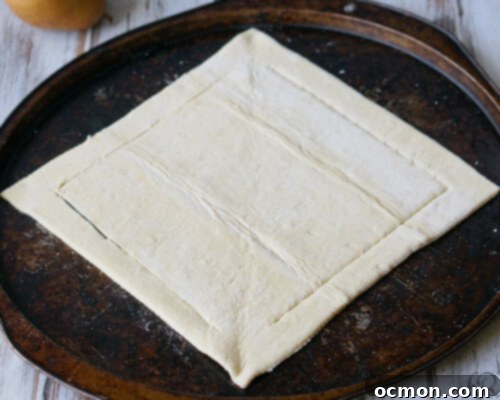 Preparing plums and pears for a galette filling