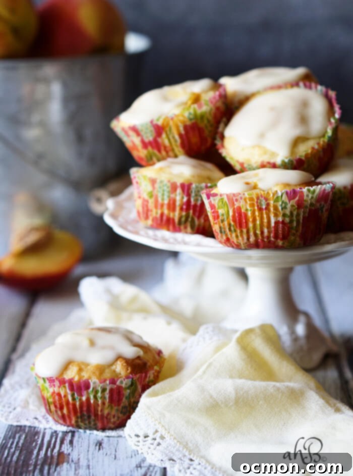 Delicious Peaches and Cream Muffins recipe with a creamy vanilla glaze, perfect for a summer breakfast