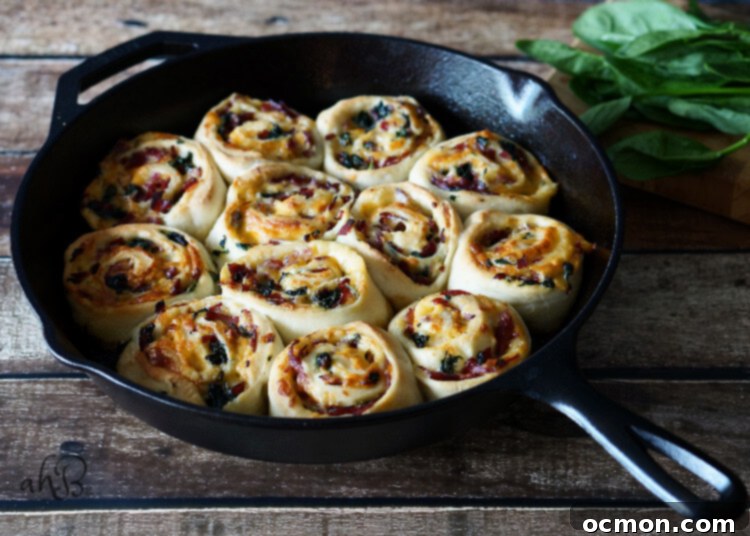 Assembled Roast Beef and Gouda Rolls ready for baking in a skillet