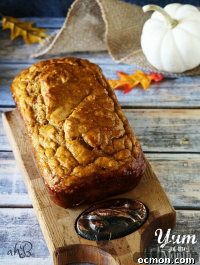 Cozy Pumpkin Ale Bread 2 Homemade Pumpkin Beer Bread topped with cinnamon honey butter, ready for fall season