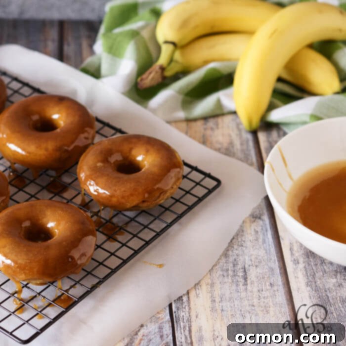 Moist banana bread-like donut dipped in a gorgeous buttery dark caramel glaze that sets up so pretty, with a pinch of salt to even out the sweetness. Recipe on www.accidentalhappybaker.com @AHBamy