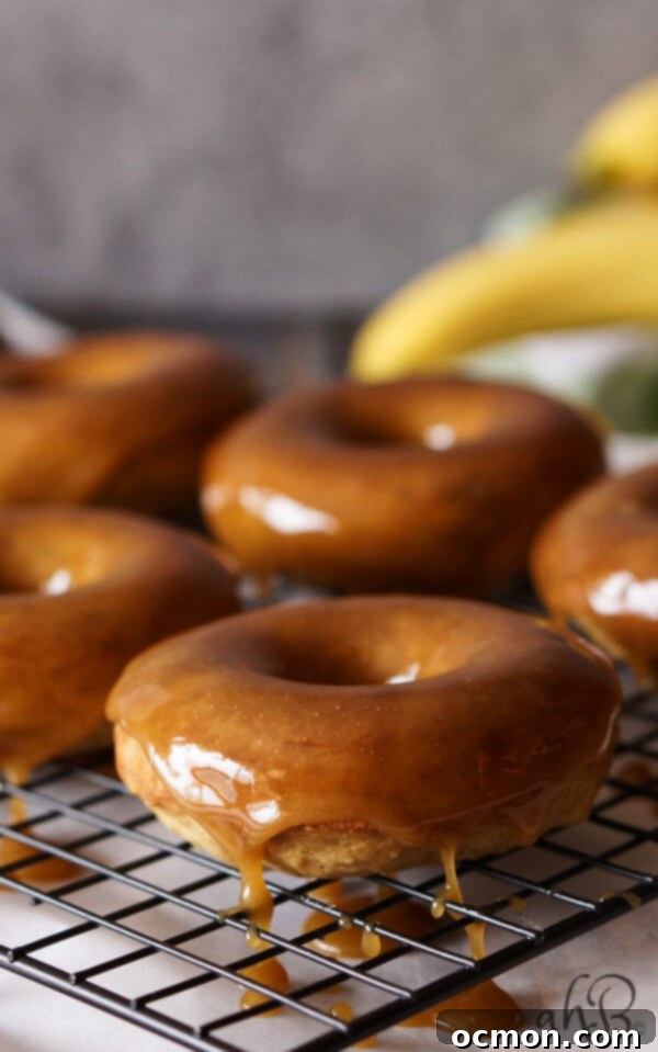 Salted Caramel Banana Donut Bliss 5 Moist banana bread-like donut dipped in a gorgeous buttery dark caramel glaze that sets up so pretty, with a pinch of salt to even out the sweetness. Recipe on www.accidentalhappybaker.com @AHBamy