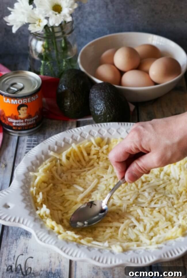 Smoky Southwestern Chipotle Quiche 4 Hearty slice of Southwestern Chipotle Quiche on a plate, showcasing its rich, colorful filling and golden hashbrown crust.