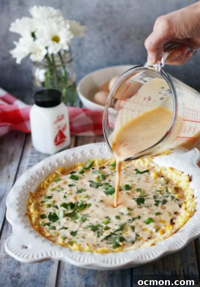 Smoky Southwestern Chipotle Quiche 6 A large, inviting Southwestern Chipotle Quiche, showcasing its golden crust and delicious, hearty filling, ready to be sliced.