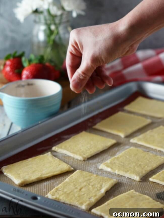 Close up of a single Strawberry Napoleon with a dollop of whipped cream on top.