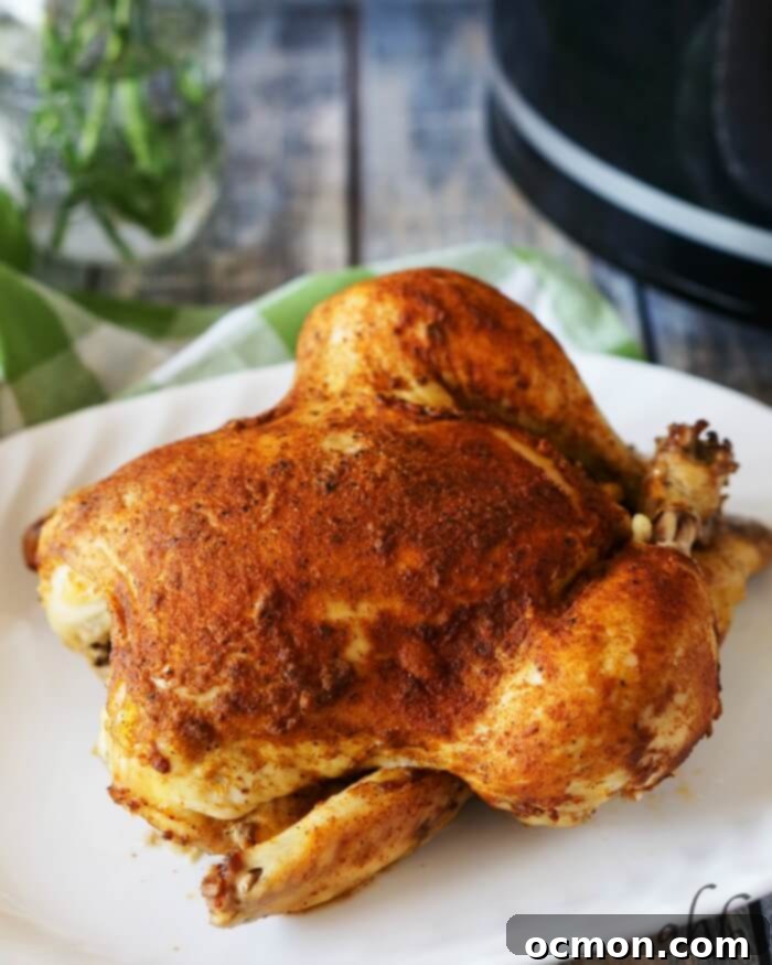 Slow Cooker Tender Roasted Chicken 3 A beautifully roasted whole chicken with crispy skin, fresh out of the slow cooker.