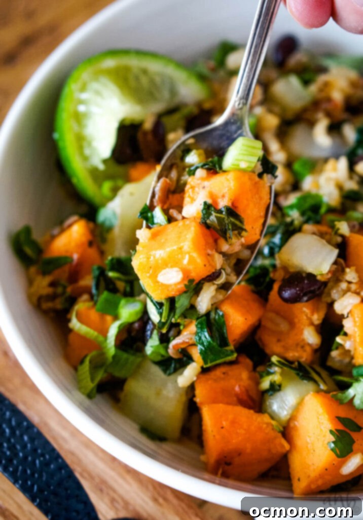 A beautifully presented sweet potato sweet chili bowl with fresh ingredients