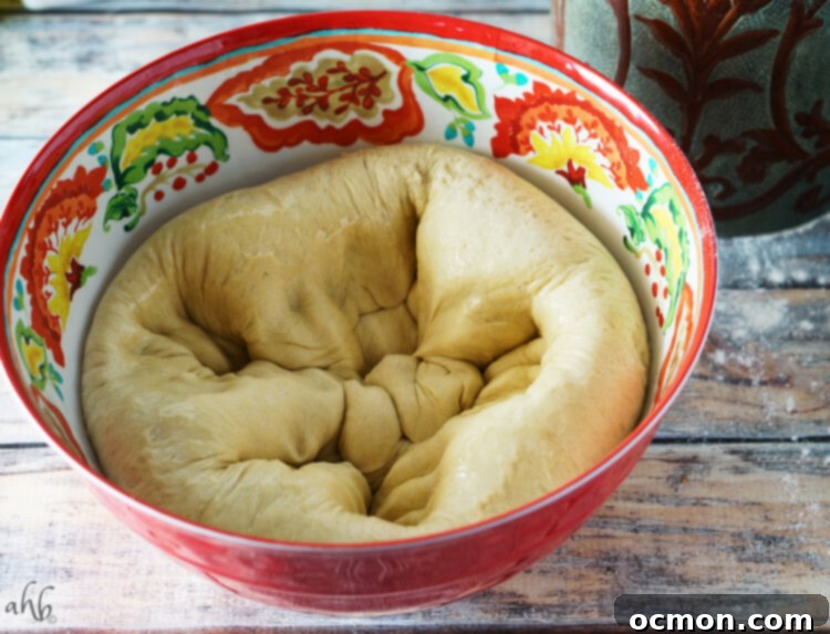 Punching down the dough for Hawaiian rolls