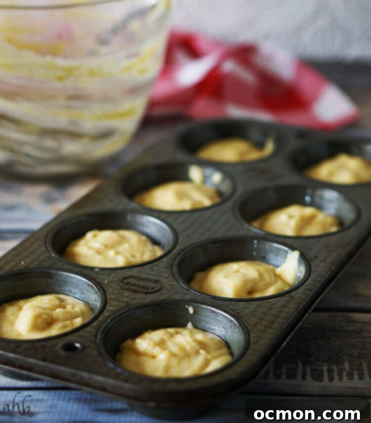 Boxed Cornbread: The Secret to Baking Brilliance 6 A muffin tin filled with cornbread batter, ready to pop into the oven.