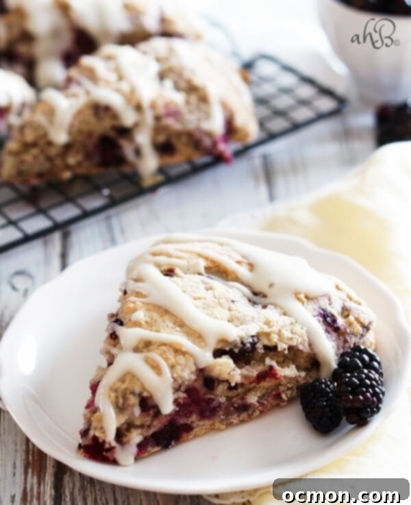 Decadent Blackberry Cream Cheese Scones 6 Assorted Blackberry Cream Cheese Scones with glaze on a serving plate