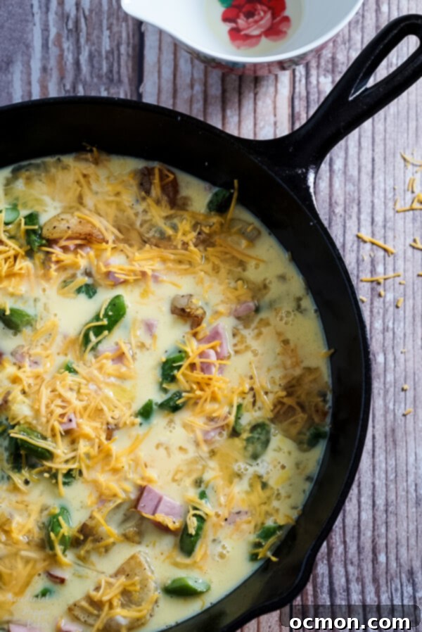 Hearty Ham, Asparagus, and Potato Frittata 4 Next the eggs are added to the vegetables before going into the oven.