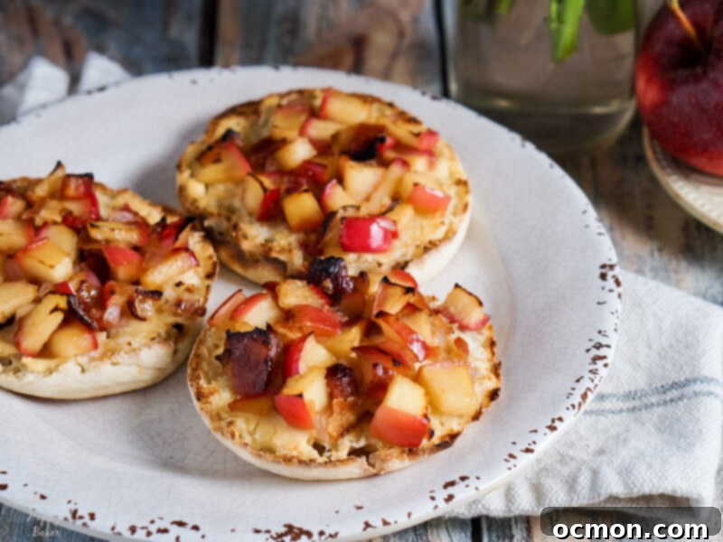 Single Apple Bacon Cheese English Muffin with fork