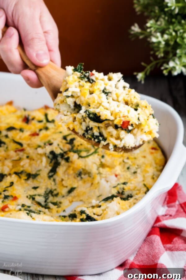 Verdant Rice & Spinach Gratin 8 Getting ready to serve a spoonful of casserole.