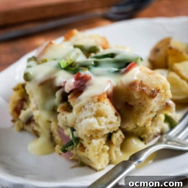 Spring Ham and Asparagus Bake 8 Layers of English muffins, ham, asparagus and cheese are drenched in eggs, Hollandaise mix and half and half for a hearty breakfast casserole that works great anytime of year. #ham #asparagus #breakfastcasserole #breakfastrecipe #accidentalhappybaker