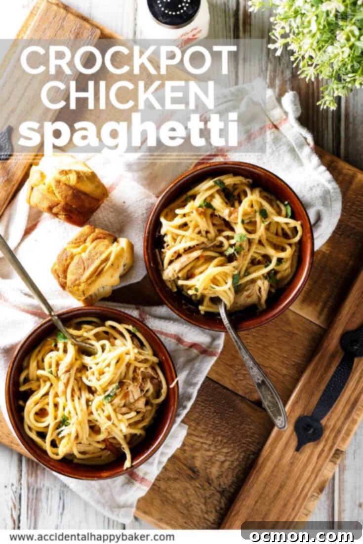 Large serving of Crockpot Chicken Spaghetti in a white dish, garnished with cilantro