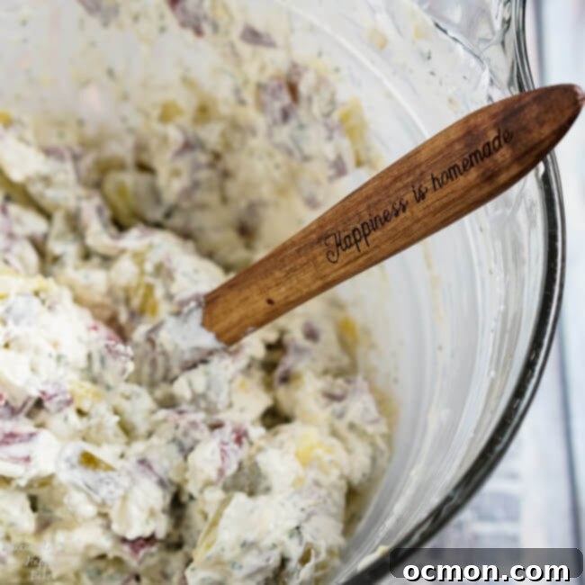 Scoop of Creamy Dill Pickle Dip on a cracker.