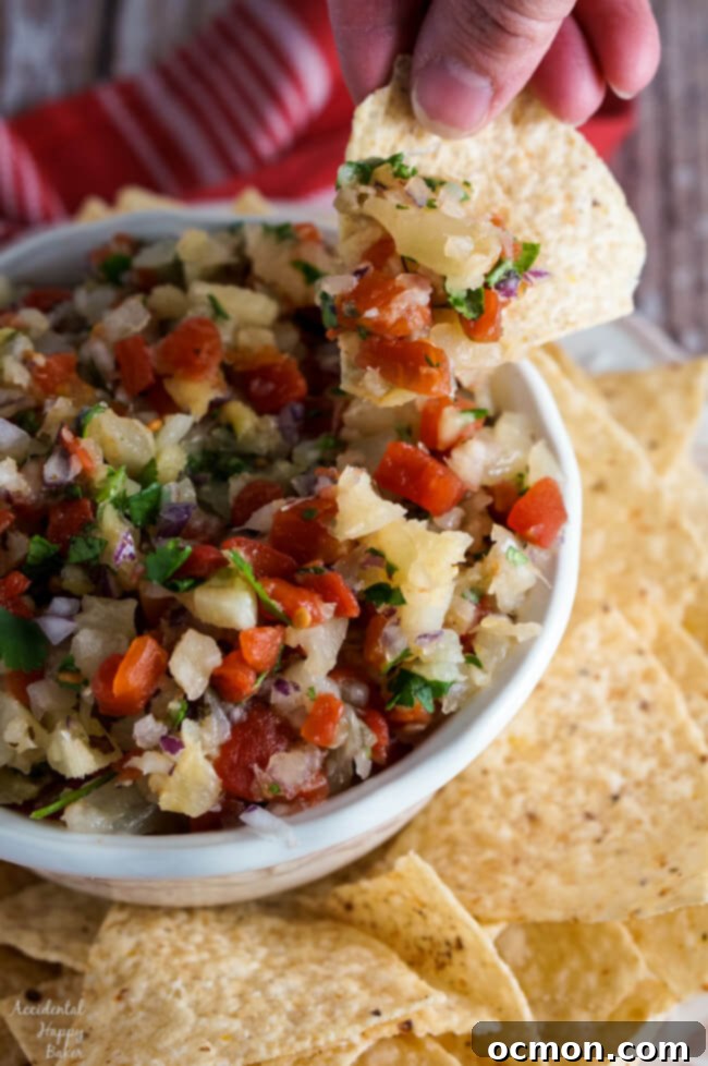 Easy Pineapple Salsa on a tortilla chip