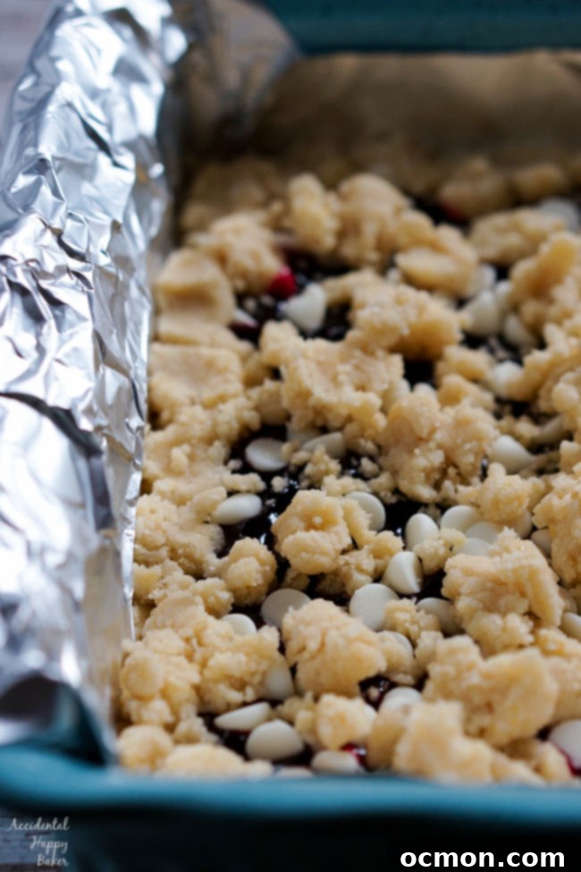 Raspberry White Chocolate Shortbread Bars 5 Crumble the remaining shortbread dough over the filling.