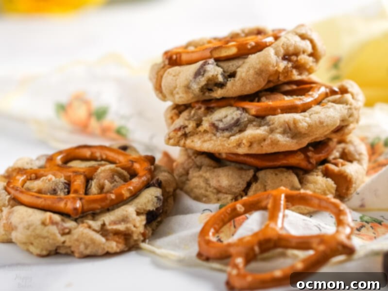 Peanut Butter Pretzel Chocolate Chip Perfection 4 A stack of Peanut Butter Pretzel Chocolate Chip Cookies, highlighting the crunchy pretzel bits and gooey chocolate chips.