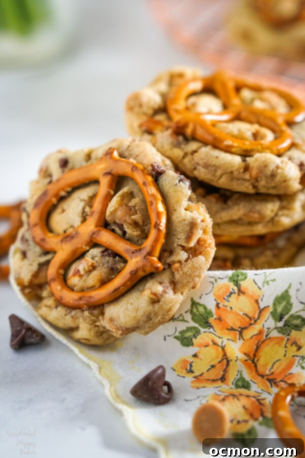 Peanut Butter Pretzel Chocolate Chip Perfection 7 A stack of Peanut Butter Pretzel Chocolate Chip Cookies, ready to be eaten.