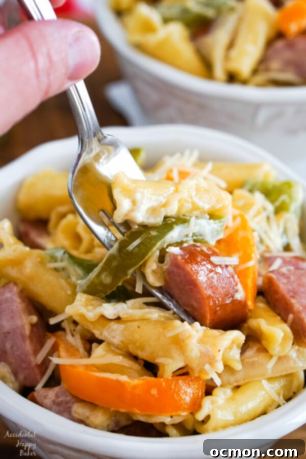 Cajun Kick Alfredo 5 A serving of Cajun Sausage Pasta, showcasing the rich sauce and perfectly cooked ingredients in a rustic bowl.