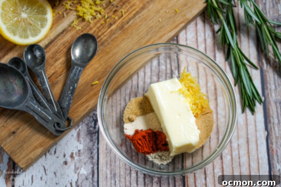 Golden Roast Chicken 4 A whole raw chicken prepared for roasting, with lemons and rosemary nearby.